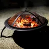 A fire pit with glowing embers and flames, set on a gravel surface at dusk. Náhľad obrázku produktu