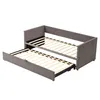 A gray upholstered daybed with a pull-out trundle bed, both with wooden slats, shown against a white background. Produktbild-Vorschau