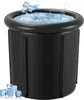 A black inflatable ice bath filled with water and ice cubes, with some ice cubes scattered around the base. Produktbild-Vorschau