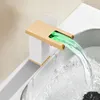 A modern bathroom faucet with a waterfall spout and LED lighting. Podgląd zdjęcia produktu