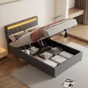 A bed with its storage compartment open, revealing organized items inside, in a bedroom setting. Náhľad obrázku produktu