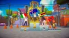 A podium with three figures holding flags of different countries, set against a colorful, cartoonish urban background. Produktbild-Vorschau