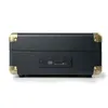The back view of a black record player stereo system with gold accents and ports. Voir les images du produit