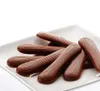 A pile of chocolate fingers on a white plate. Produktbild-Vorschau
