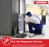 A repairman is fixing a refrigerator in a kitchen. Produktbild-Vorschau
