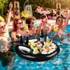 People enjoying a pool party with drinks on a floating tray. Náhled obrázku produktu