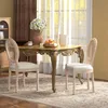 A dining set with two chairs and a table in a well-lit room. Náhled obrázku produktu