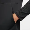 A close-up shot of a person's hand in the pocket of a black jacket. Produktbild-Vorschau