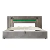 A grey upholstered bed frame with a green LED light strip in the headboard, shown from the front. Produktbild-Vorschau