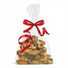 A clear cellophane bag filled with cookies, tied with a red ribbon. Podgląd zdjęcia produktu