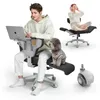 A man and a dog are sitting on an office chair, with a woman in the background also on a chair. Podgląd zdjęcia produktu