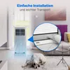 A portable air conditioner is shown in a living room setting with a dog lying on the floor. Podgląd zdjęcia produktu