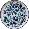 A ceramic plate with a blue floral pattern. Voir les images du produit