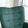 Close-up of the textured fabric of a dark green armchair. Anteprima dell’immagine prodotto