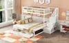 A white bunk bed with a trundle bed is set up in a bedroom, with a desk and chair nearby. The room has soft pink walls and a large window with sheer curtains. Podgląd zdjęcia produktu