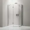 A modern glass shower enclosure with chrome fixtures against a plain wall. Produktbild-Vorschau