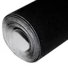 A roll of black velvet fabric is shown from the side. Produktbild-Vorschau