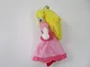 A plush toy of Princess Peach from Nintendo, shown from the side against a white background. Náhľad obrázku produktu