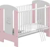 A baby crib with a mattress and decorative elements. Produktbild-Vorschau