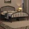 A bedroom scene with a metal bed frame, bedding, a lamp, and a rug. Podgląd zdjęcia produktu