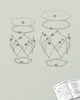 An exploded view diagram showing the components and assembly of two tables, with a small instruction manual visible in the corner. Produktbild-Vorschau