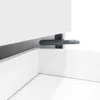 A close-up view of a push-to-open mechanism on a white cabinet or drawer. Anteprima dell’immagine prodotto