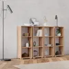 A modern living room with a bookshelf and a floor lamp. Produktbild-Vorschau