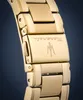 Close-up of a gold-colored watch clasp with the Maserati logo and name engraved. Produktbild-Vorschau