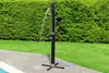 An outdoor shower is set up on a patio next to a lawn and a hedge. Produktbild-Vorschau
