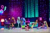A group of Monster High dolls are gathered in a room with neon lights and a couch. Náhľad obrázku produktu