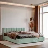 A modern bedroom with a mint green upholstered bed. Anteprima dell’immagine prodotto