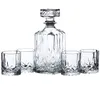 A clear studio shot of a crystal decanter and four matching glasses, arranged on a white background. Produktbild-Vorschau