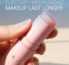 A hand holding a pink balm stick with the product's tip exposed. Náhled obrázku produktu