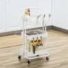 A white three-tier kitchen cart filled with kitchen utensils and jars, placed on a wooden floor in front of white kitchen cabinets. Náhled obrázku produktu