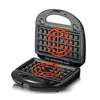 An open black waffle maker with glowing red heat elements on the cooking plates. Anteprima dell’immagine prodotto