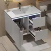 A modern white bathroom vanity with a sink and drawers, featuring internal LED lighting. Náhled obrázku produktu