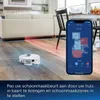 A robot vacuum cleaner is shown on a wooden floor in a living room, with a smartphone displaying its map interface next to it. Produktbild-Vorschau