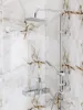 A close-up view of a modern shower set mounted on a marble-patterned wall. Produktbild-Vorschau