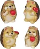 Four ceramic hedgehog figurines, each holding either a red apple or a red mushroom. Náhľad obrázku produktu