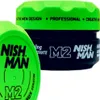 Two containers of Nishman M2 hair styling product are shown, with one in the foreground and another slightly behind and to the right. Náhled obrázku produktu