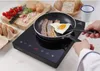 A person is cooking breakfast on an induction cooker. Voir les images du produit