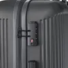 A close-up view of a gray suitcase with a TSA-approved combination lock. Produktbild-Vorschau