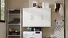 A laundry room with a washing machine, cabinets, shelves, and an ironing board. Náhled obrázku produktu