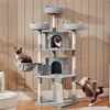 Three cats are interacting with a multi-level cat tree in a room with wood-paneled walls. Produktbild-Vorschau