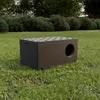A dark brown insulated cat house sits on a grassy lawn with bushes and trees in the background. Produktbild-Vorschau