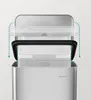 Close-up view of the top of a stainless steel trash can, showing how a trash bag is secured. Produktbild-Vorschau