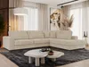A modern living room with a large sectional sofa, coffee table, and artwork.