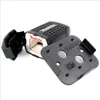 A black Makita sander accessory is shown with a detached black mounting plate on a white background. Anteprima dell’immagine prodotto
