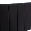 Close-up view of a black, channel-tufted headboard. Náhľad obrázku produktu