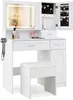 A white vanity table with a lighted mirror, jewelry storage, drawers, and a stool. Voir les images du produit